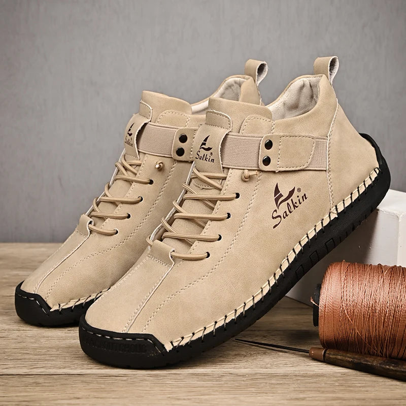 A pair of Beige handmade leather sneakers with black sole and breathable structure