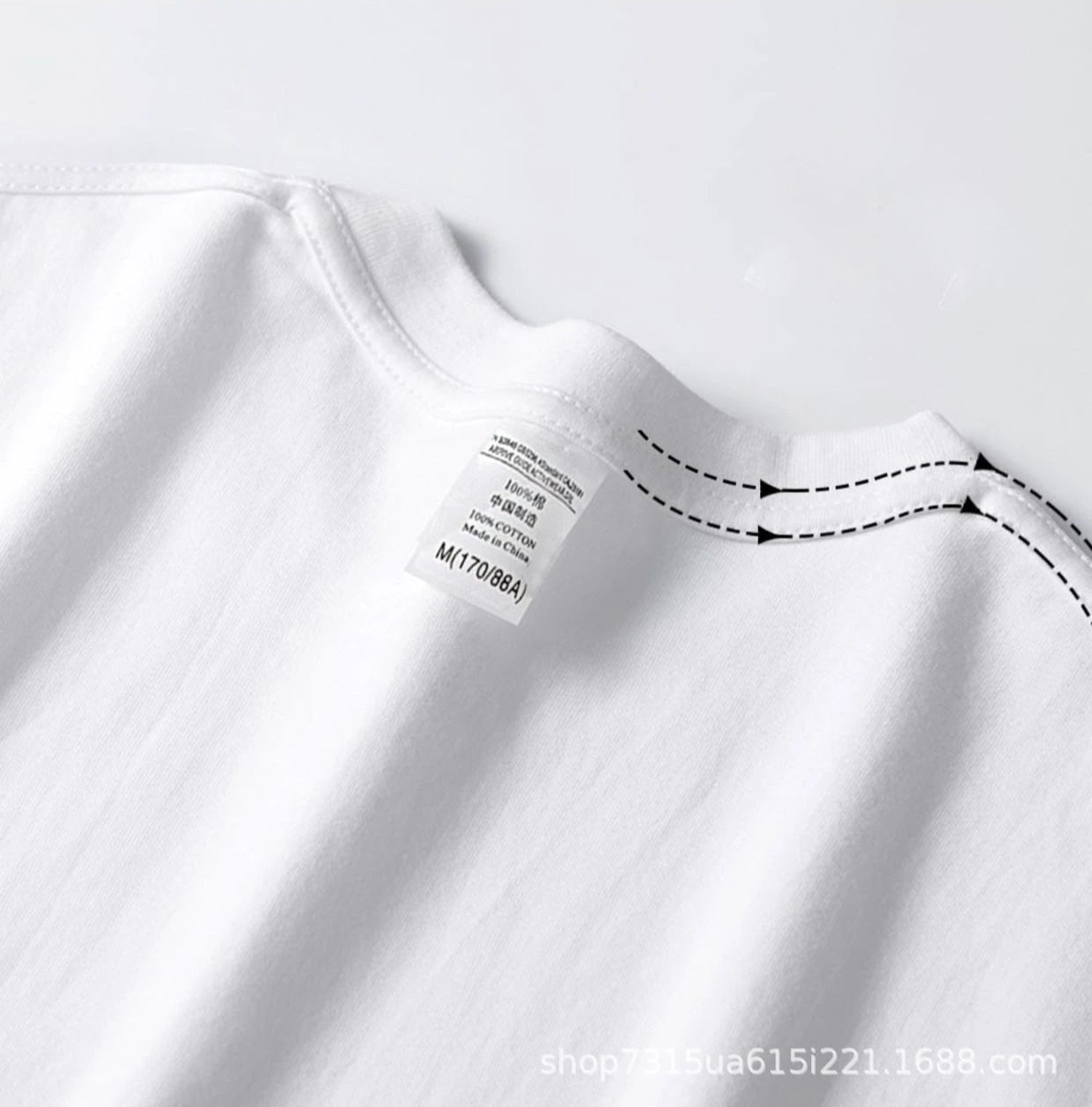 Back label and shoulder seam detail on white heavyweight T-shirt