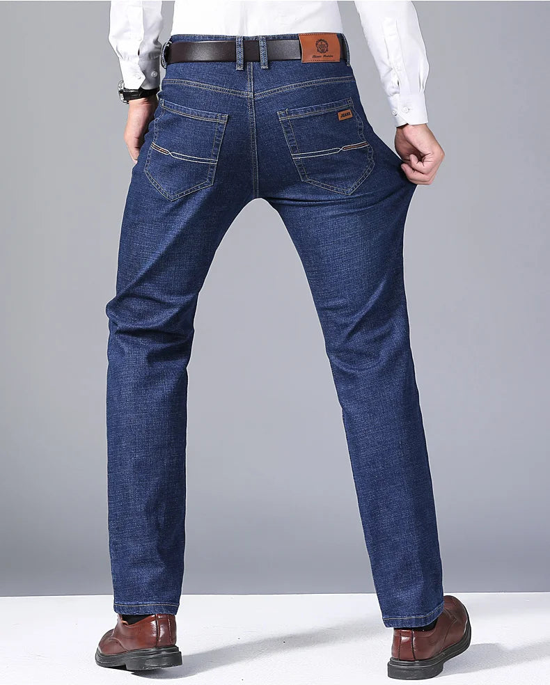 Back view of blue jeans on model demonstrating stretchability and pocket detail