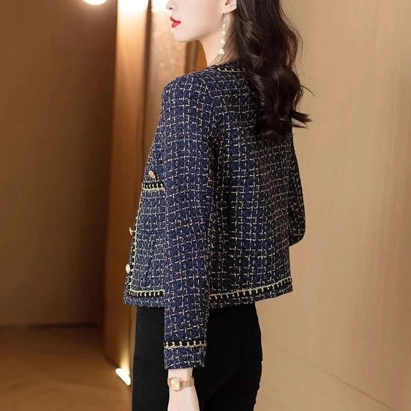 Back view showing tailored fit and textured tweed fabric