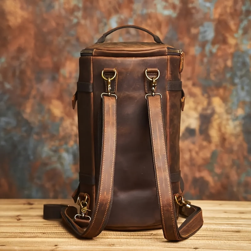 Backpack front open showing big capacity with packed items including laptop, bottle, and wallet