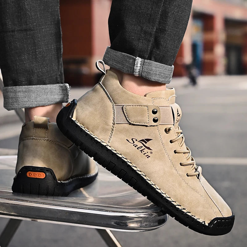Beige breathable ankle sneakers with stitched sole and slip-on design, worn outdoors