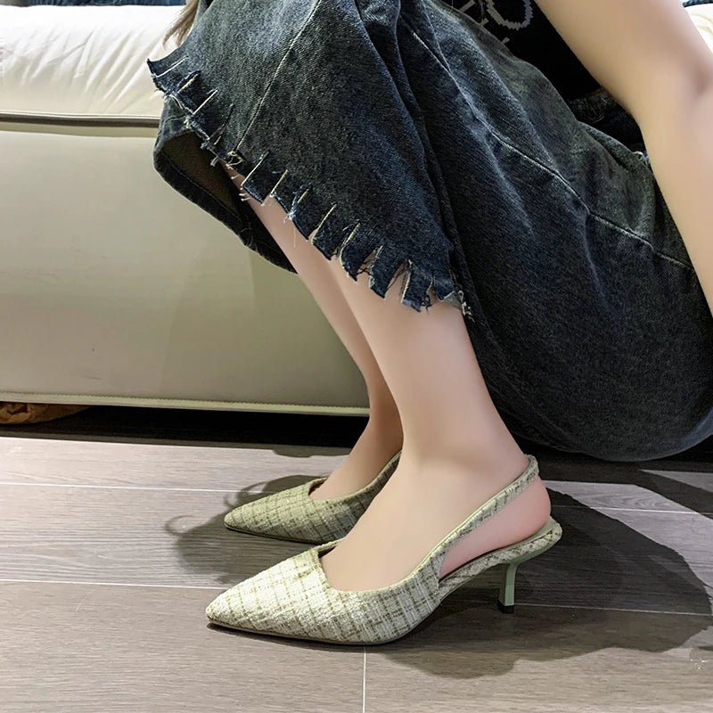 Beige tweed slingback heels close-up showing texture and heel design