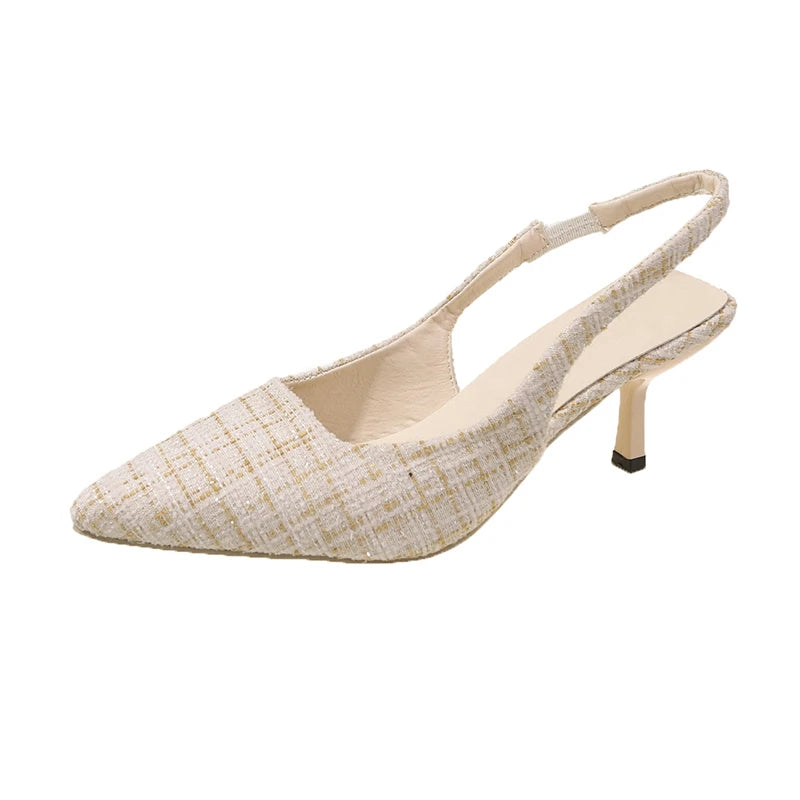 Beige tweed slingback heels with pointed toe, isolated on white background