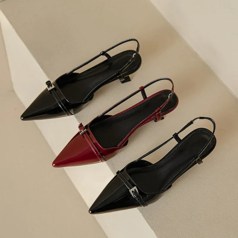 Black and wine red patent pointed-toe slingback heels side-by-side