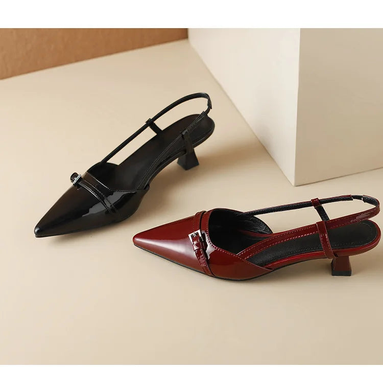Black and wine red patent pointed-toe slingback heels side-by-side, top view