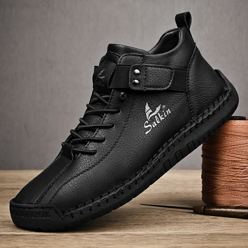 Black casual leather sneakers with elastic entry and minimalist design