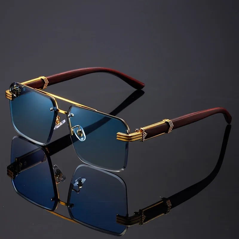 Blue lens frameless sunglasses resting on tabletop near straw decor