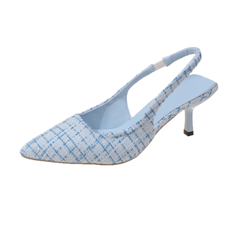 Blue tweed slingback heels with pointed toe, isolated on white background