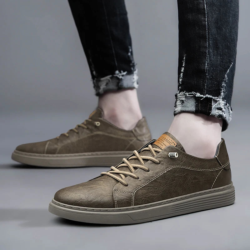Both taupe leather sneakers styled with jeans, side view showing shoe details