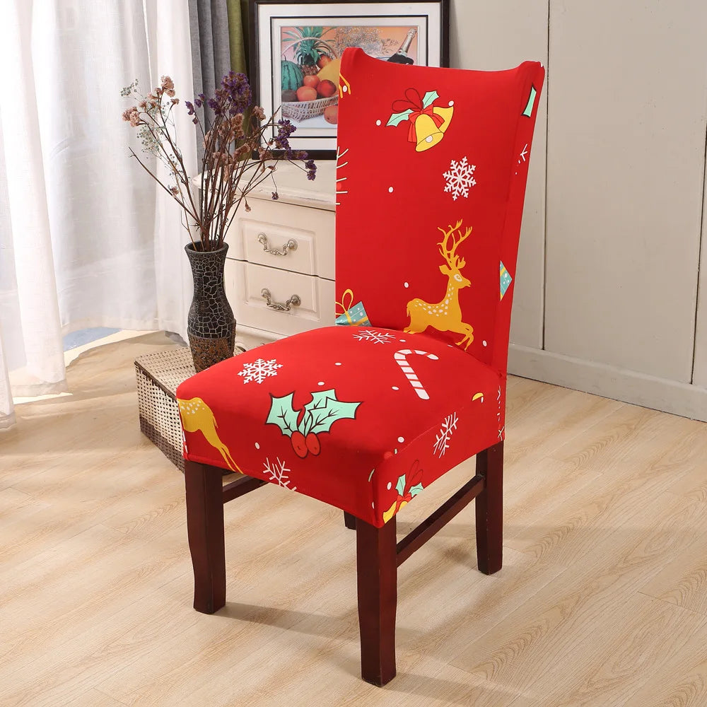 Bright red holiday-themed chair cover with reindeer, snowflakes, and candy cane motifs