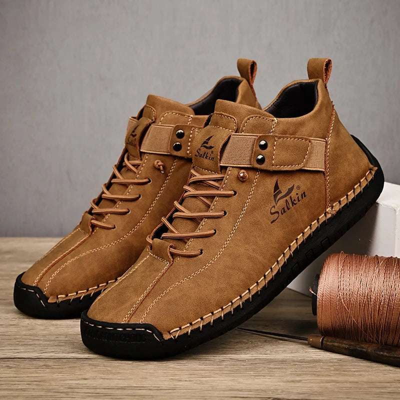 Brown leather ankle sneakers with slip-on elastic collar and detailed stitching, side view