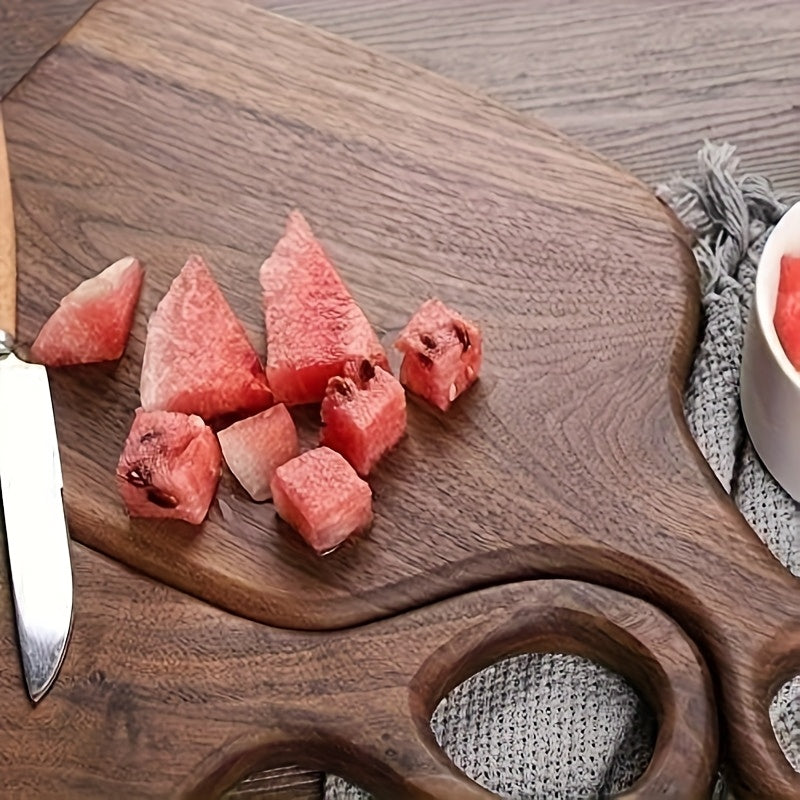 Close-up of chopped watermelon on walnut cutting board