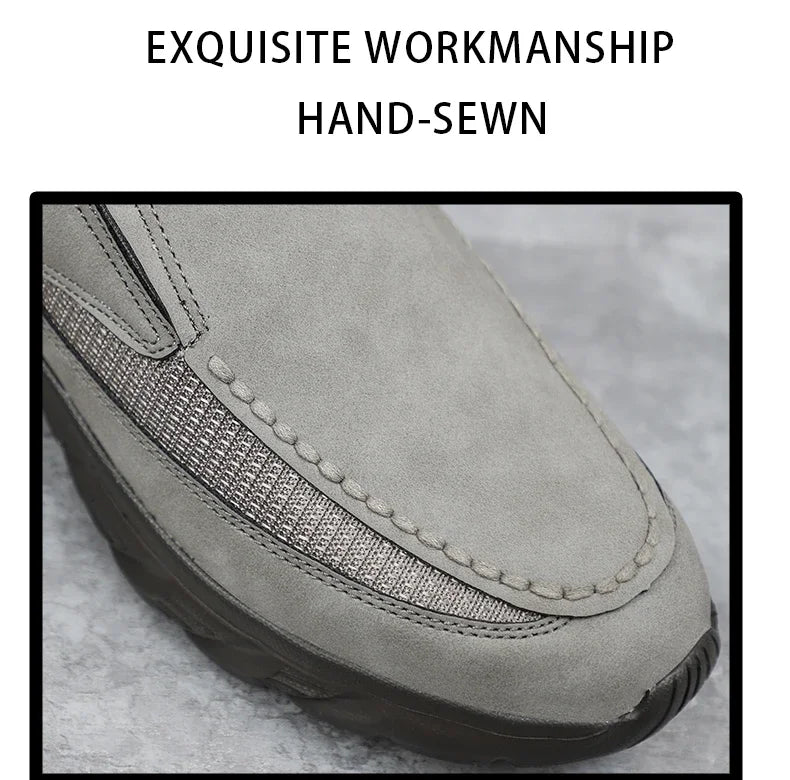 Close-up of grey leather loafer showing hand-sewn detail and mesh inlay texture