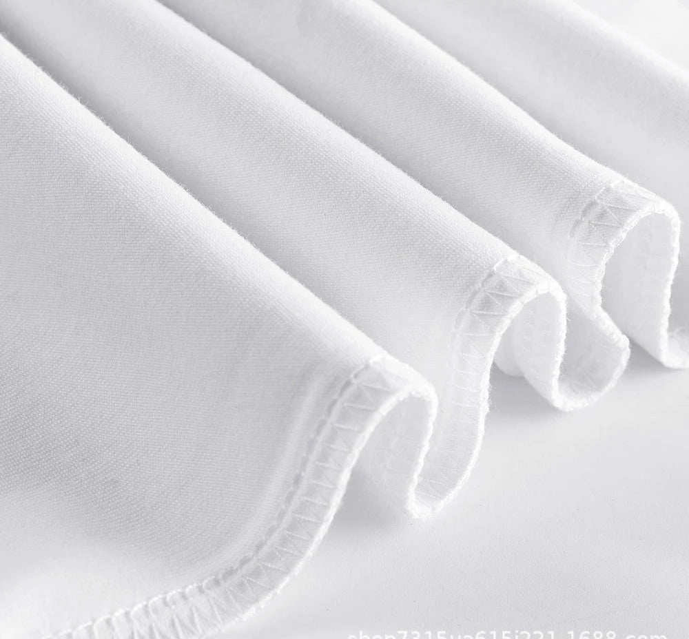 Close-up of hem stitching on thick combed cotton fabric
