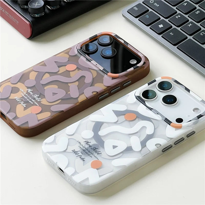Close-up of white graffiti iPhone 17 MagSafe case next to keyboard