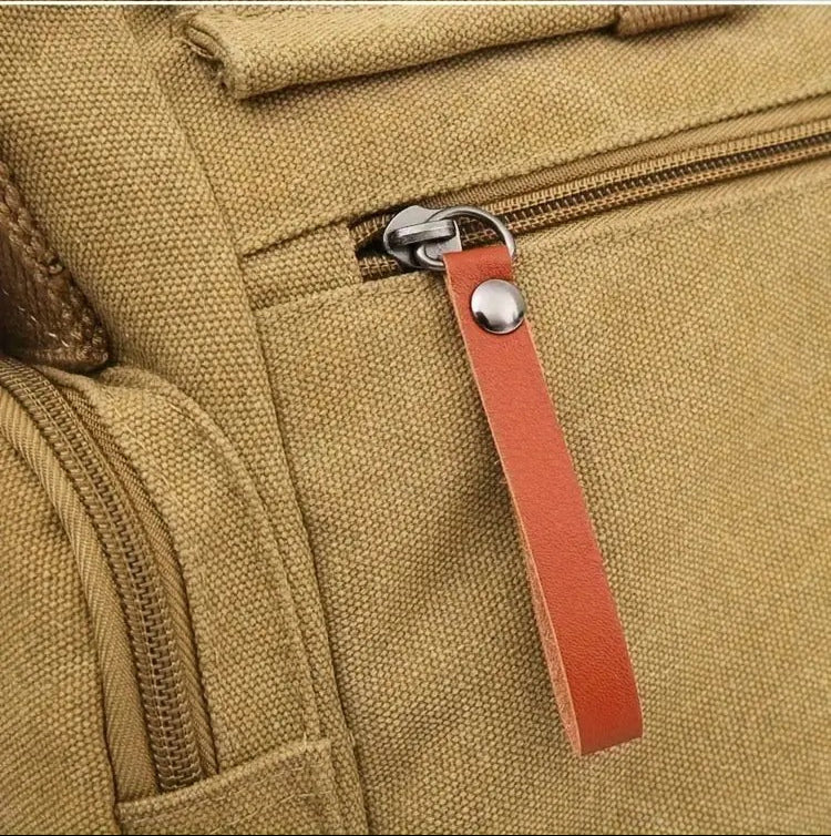 Close-up of zipper pull detail on Montero Milan messenger bag
