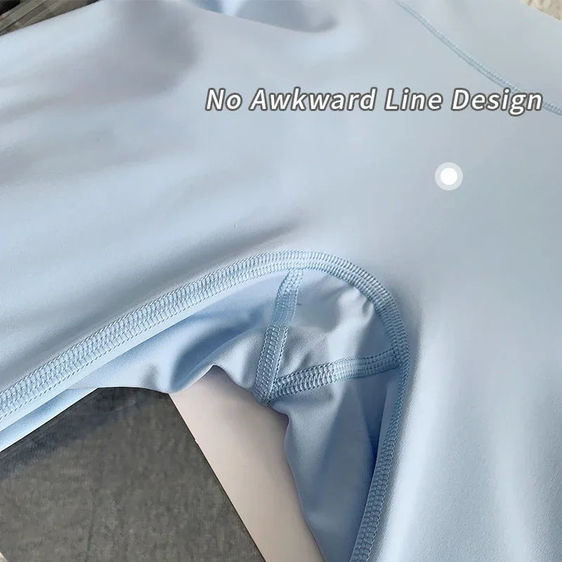 Close-up seam details of light blue yoga leggings