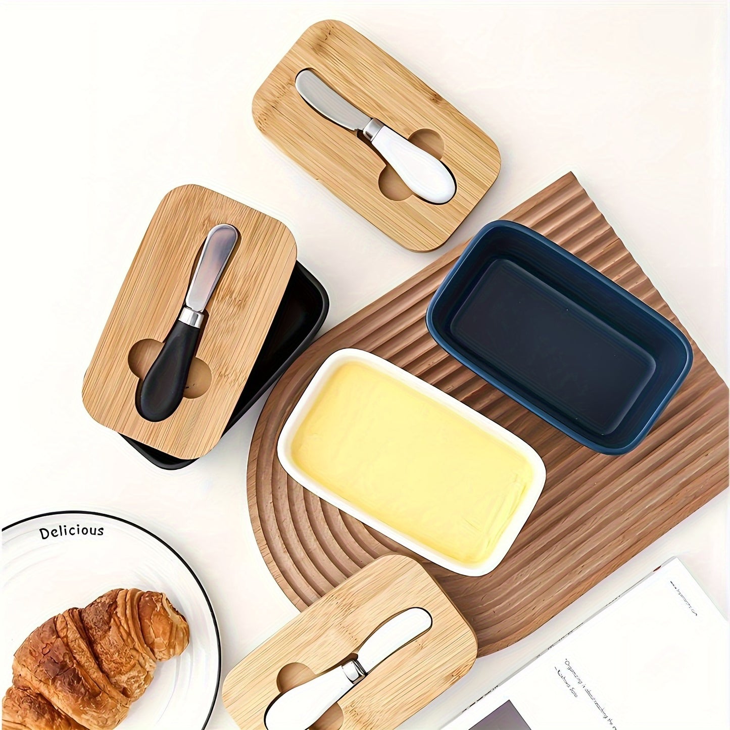 Colourful ceramic butter dish with bamboo lid and spreader, top view