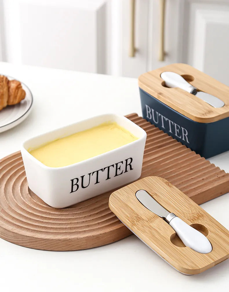 Colourful ceramic butter dish with bamboo lid, countertop display