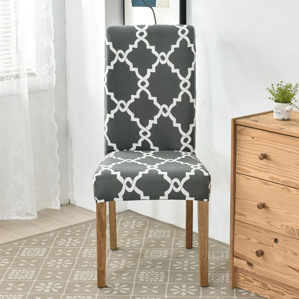 Dark gray chair cover with bold white Moroccan trellis pattern on wooden-legged chair