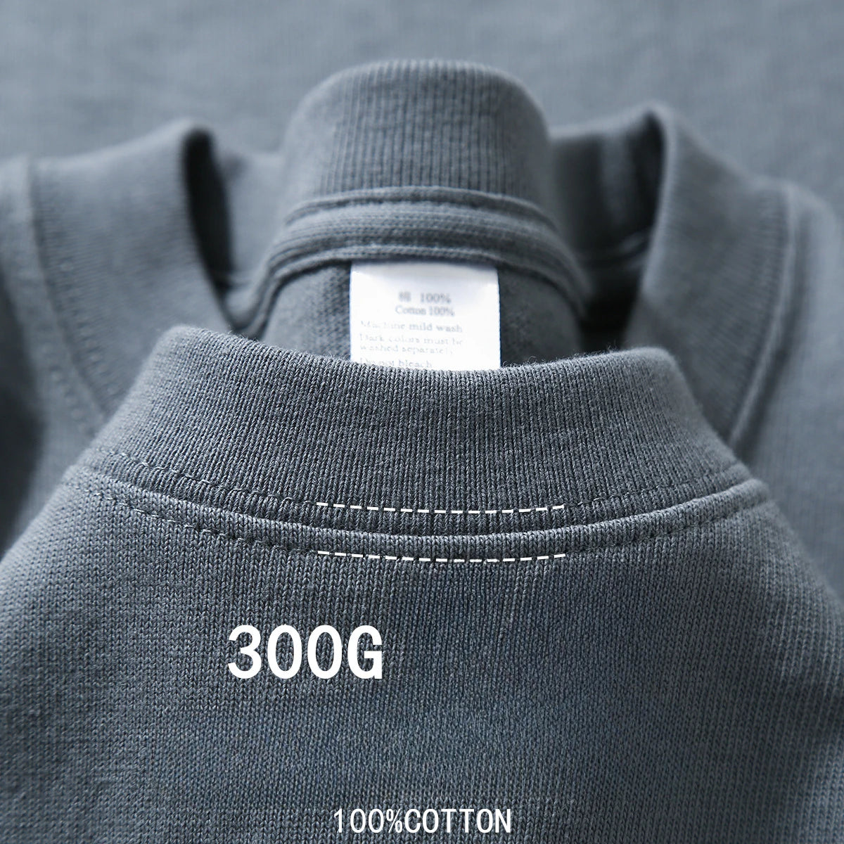 Dark grey heavyweight cotton T-shirt neckline close-up with label