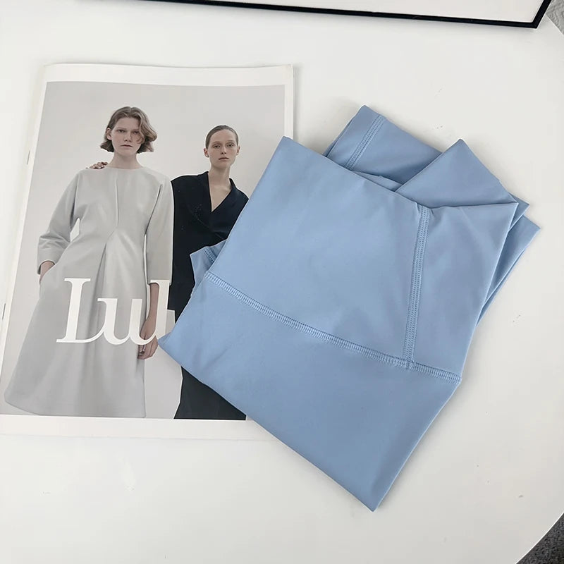 Folded light blue yoga leggings on the chair