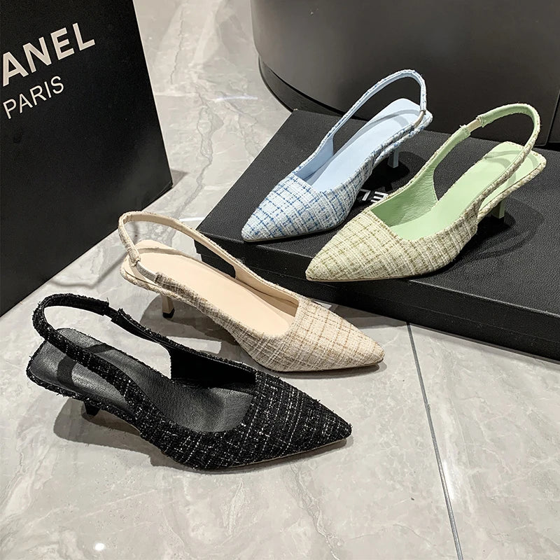 Group of tweed slingback heels in black, blue, beige, and green, displayed together