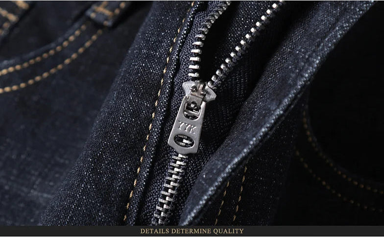 High-quality zipper detail on dark wash denim jeans, macro shot
