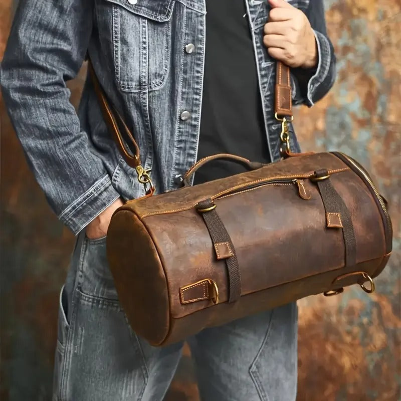 Leather travel bag in shoulder carry mode, brown vintage finish