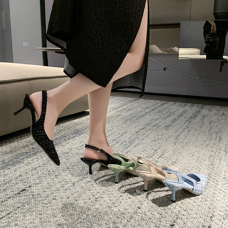 Light green tweed slingback heels with fine check pattern, worn view