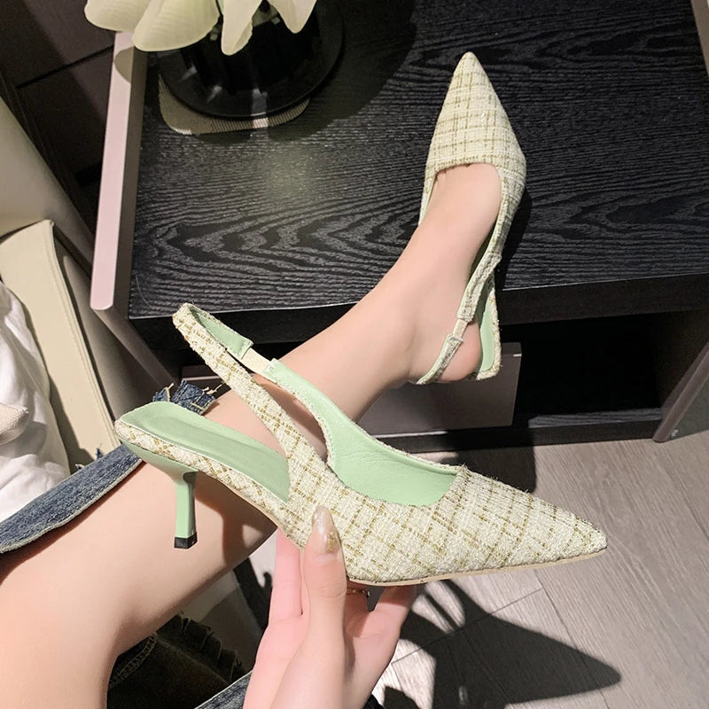 Light green tweed slingback heels with pointed toe and thin heel, side view