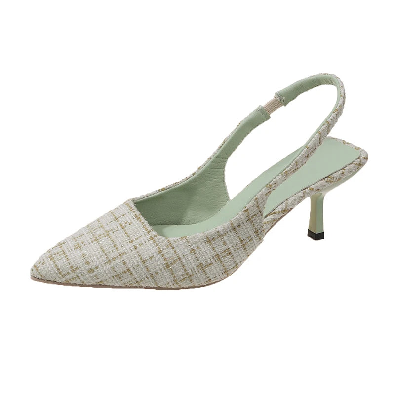 Light green tweed slingback heels with slim heel, isolated on white background