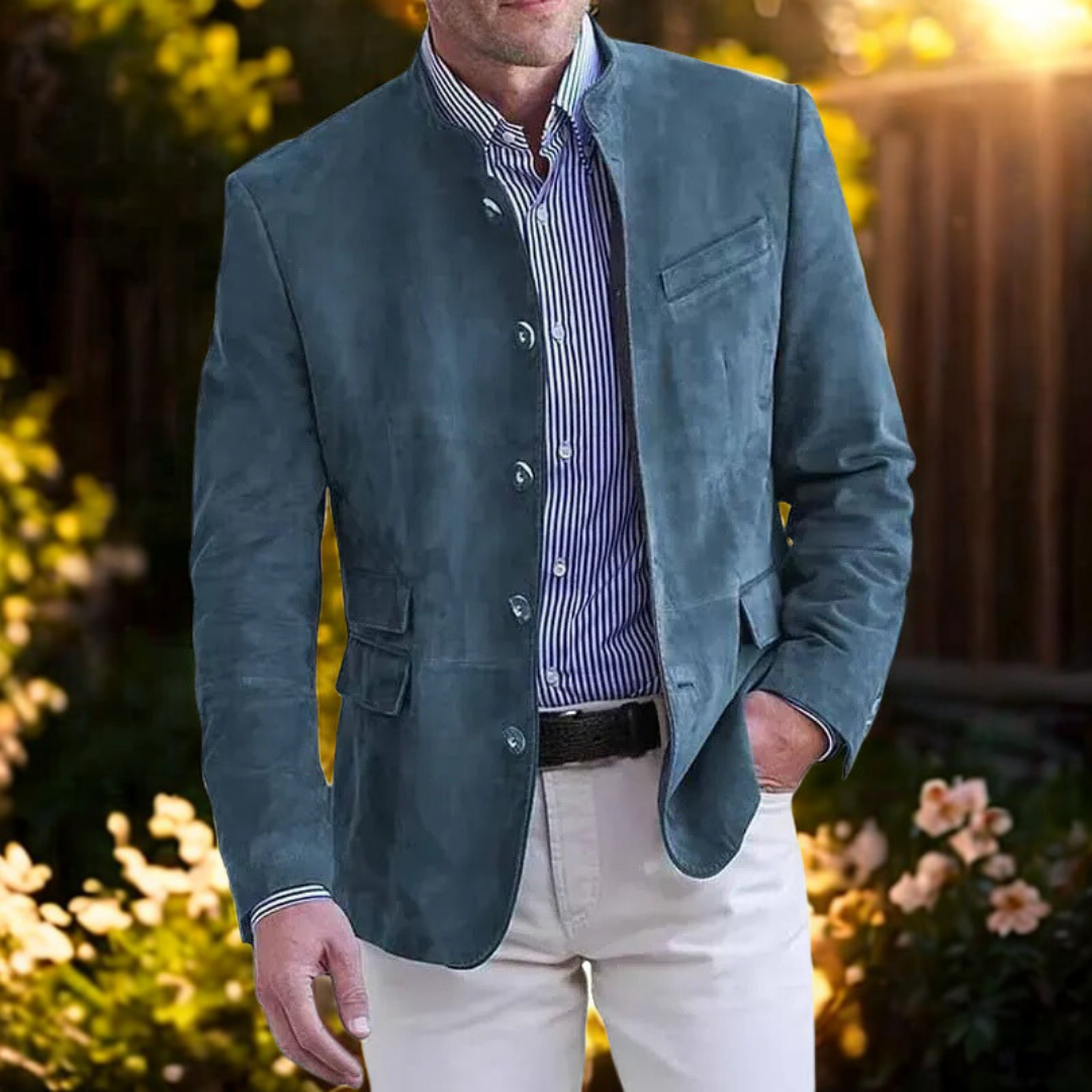 Men's blue suede-look blazer with stand collar, outdoor garden setting at sunset