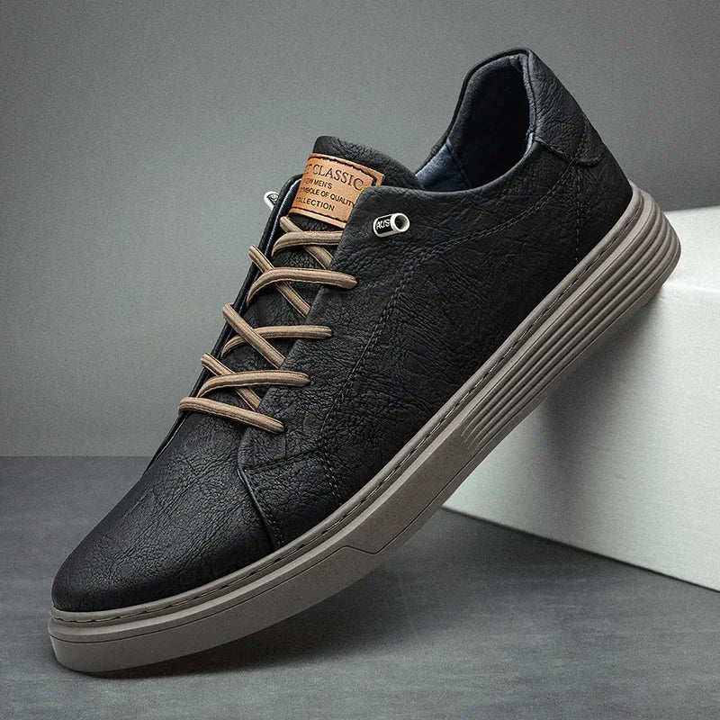 Men’s leather oxford sneakers in black with beige laces, side view on display stand