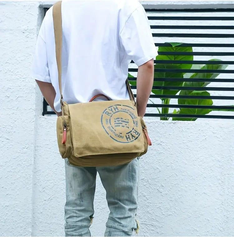 Model carrying Montero Milan messenger bag in outdoor urban setting