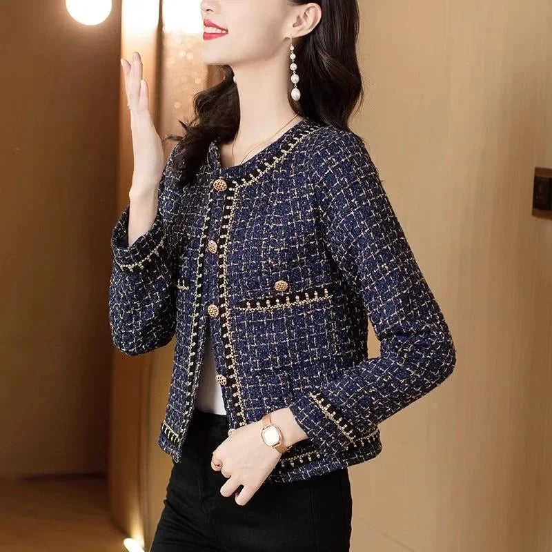 Model showing front view of navy tweed chain-trim jacket