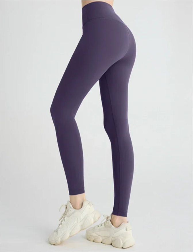 Model showing purple yoga leggings full side view