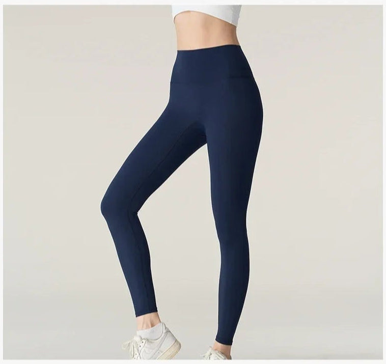 Model showing purple yoga leggings full view