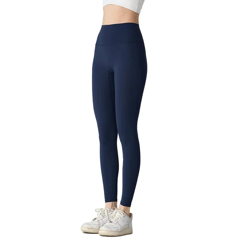 Model wearing navy blue high waist yoga leggings