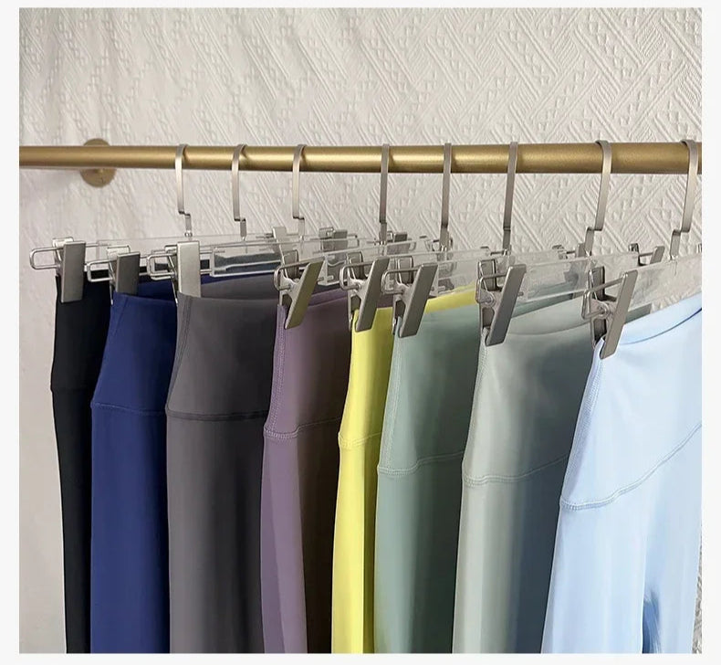 Multiple yoga leggings on rack in assorted shades