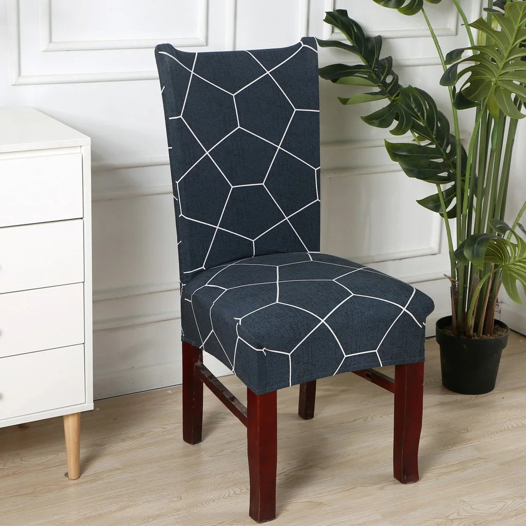 Navy blue stretch chair cover with white hexagonal line pattern in modern room