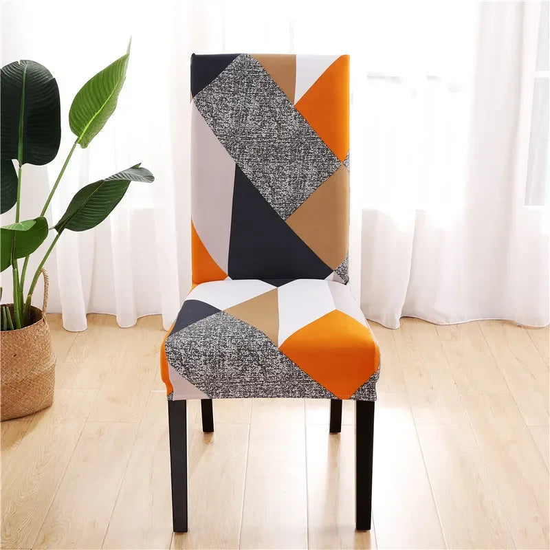 Orange and gray patchwork-style stretch chair cover over dining chair