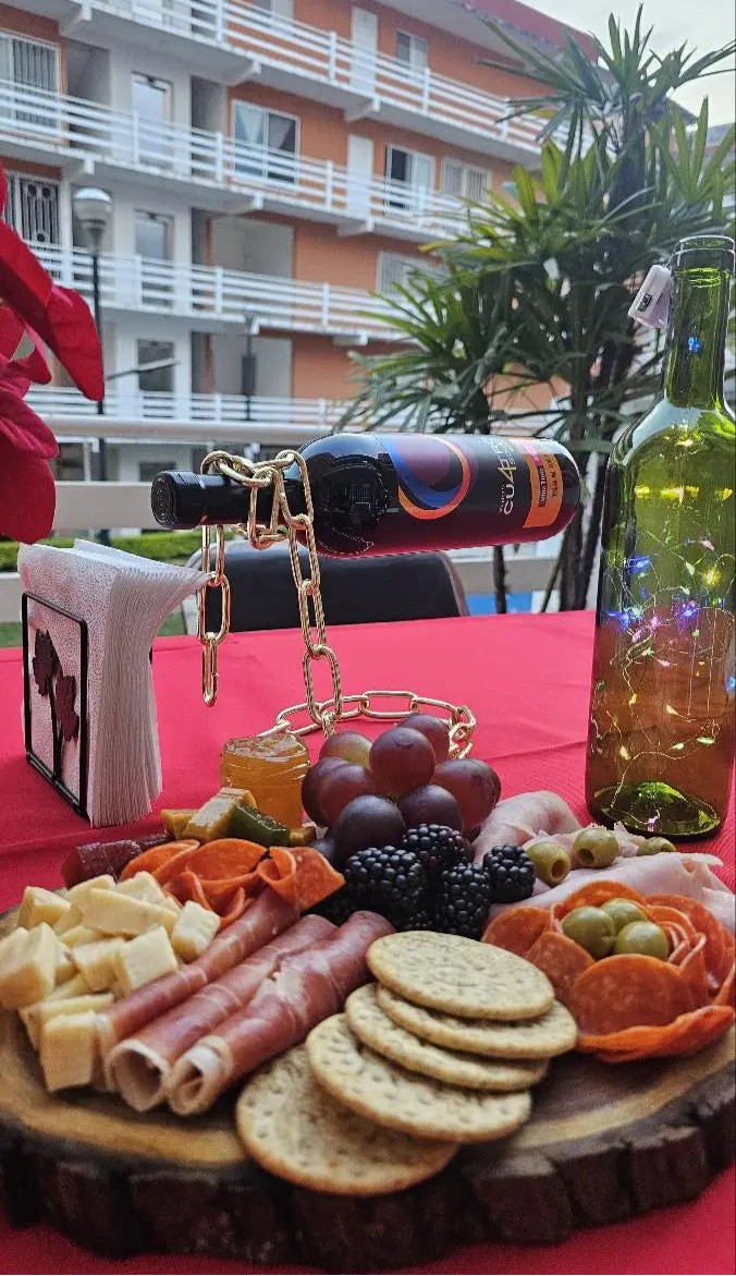 Outdoor display of multiple chain wine holders with hanging meat skewers