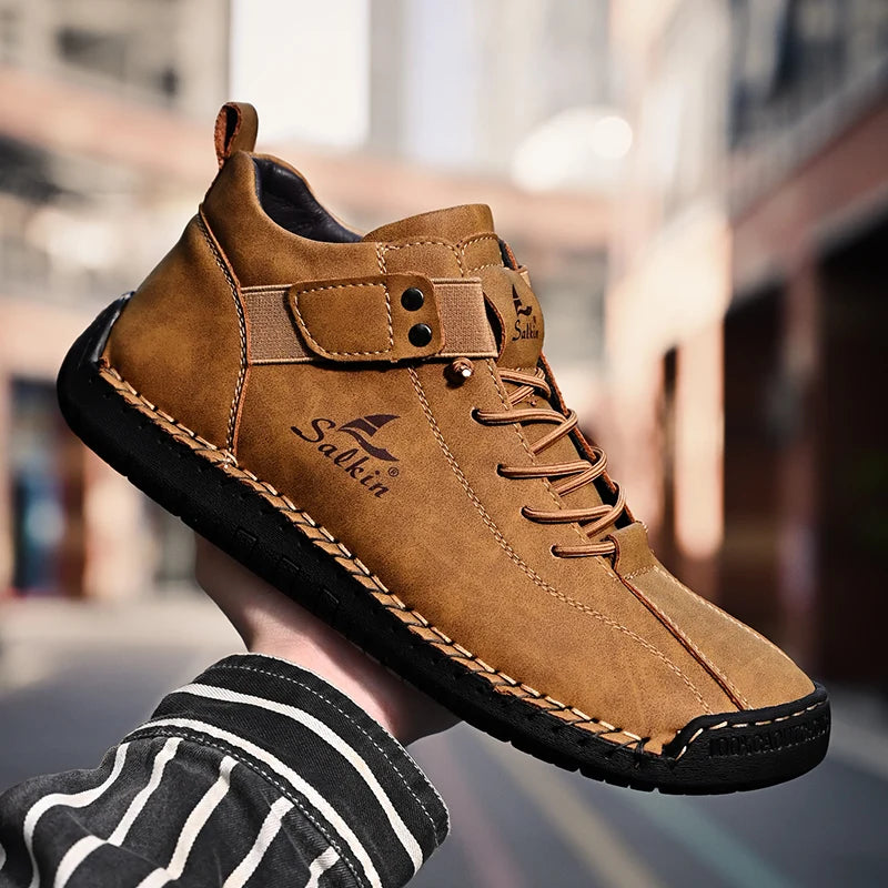 Outdoor scene with brown breathable ankle sneakers held in hand, casual style