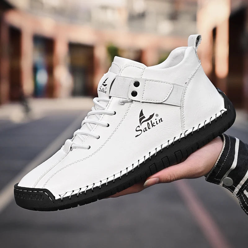 Outdoor scene with white breathable ankle sneakers held in hand, casual style