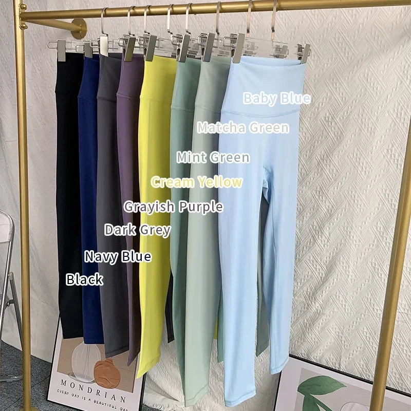Row of yoga leggings hanging neatly in various colors