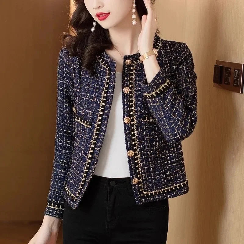 Side view of navy tweed cropped jacket with gold buttons