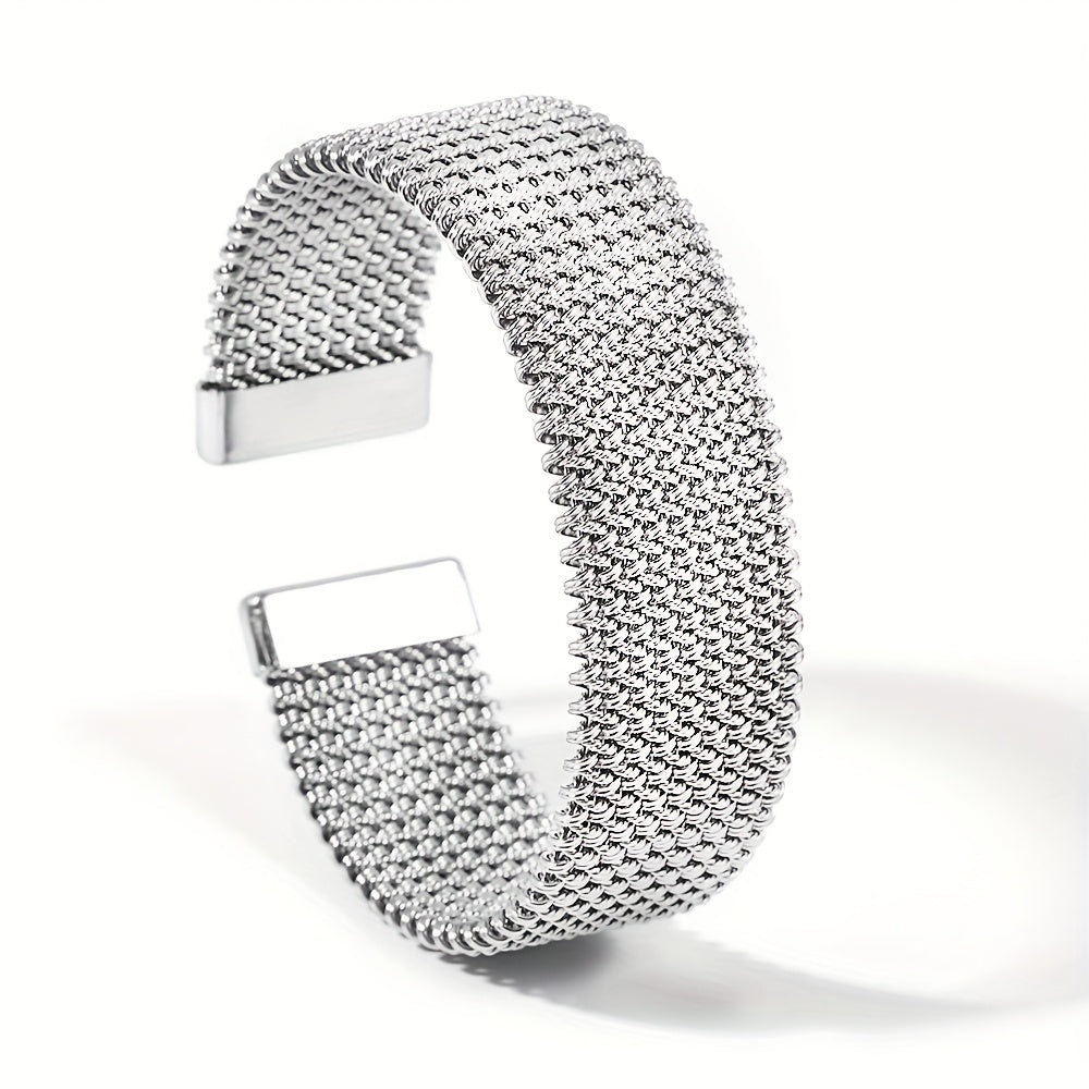 Silver-tone version of woven stainless steel cuff bracelet on white background