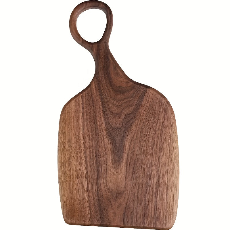 Single walnut cutting board with loop handle, full front view on white